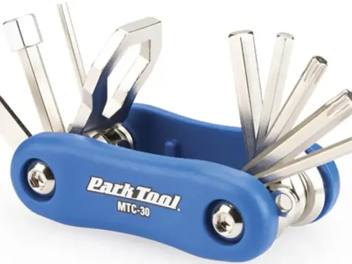 Narzędzie wielofunkcyjne Park Tool MTC-30 z niebieską rączką, zawierające różne klucze imbusowe i Torx. Idealne, jakie klucze do roweru na szybkie naprawy w trasie.