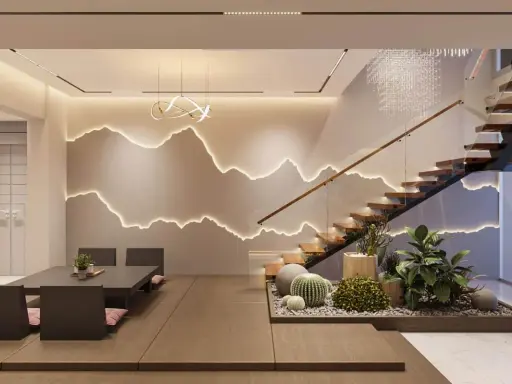 Intérieur moderne avec escalier en bois, éclairage mural en forme de montagnes et mobilier épuré.