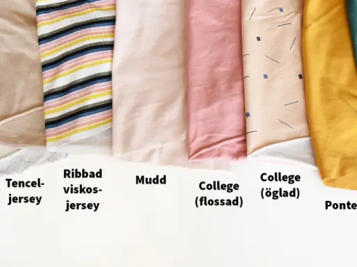 Olika tyger i rullar, från hjärtmönstrat bomullsjersey till stickad jacquard och bomulls-fleece. Vissa har fina stygn i kant.