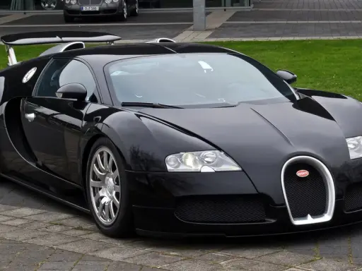 Czarny Bugatti Veyron, symbol luksusu i osiągów. Jego imponująca bugatti veyron cena sprawia, że jest marzeniem wielu kolekcjonerów.