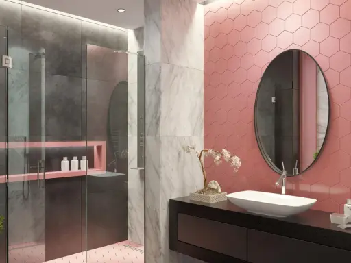 Bagno moderno con pareti rosa a nido d'ape, doccia in vetro e marmo. Un lavabo ovale su mobile nero e specchio rotondo completano le idee bagno rosa.