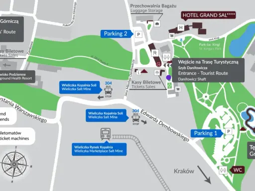 Mapa Kopalni Soli Wieliczka z zaznaczonym parkingiem, wejściami na trasy, kasami biletowymi i atrakcjami.