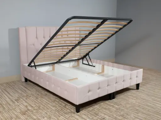 Cama canapé rosa con somier elevable, ideal para almacenar. La diferencia entre canapé y somier es el espacio de almacenamiento oculto.