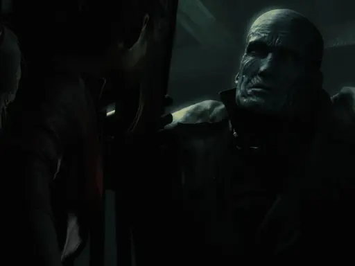 Potworna twarz Nemesisa z Resident Evil w mroku, groźnie spogląda na Claire.