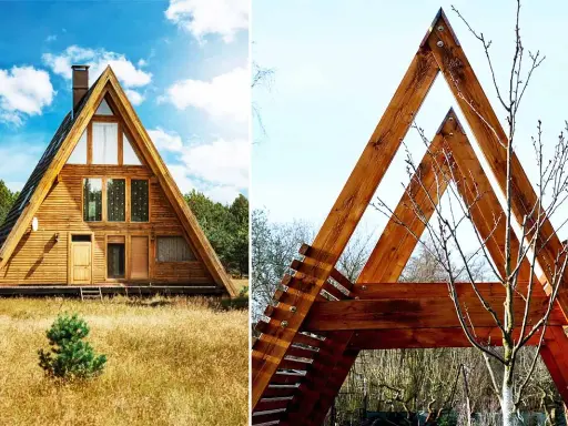 Une maison en A, en bois, se dresse dans un champ d'herbes hautes. Une autre structure triangulaire en bois, avec un arbre nu, est visible à droite.