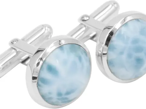 Gemelli eleganti con pietra del gemelli azzurra, che ricorda le onde del mare.