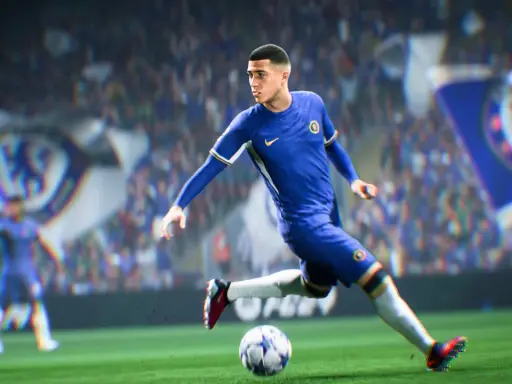 Piłkarz w niebieskiej koszulce Chelsea drybluje piłką na boisku, gotowy do strzału w grze FIFA 2k.