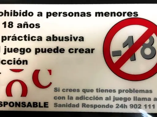 Carteles obligatorios en bares: prohibido menores de 18 años, juego responsable, adicción.