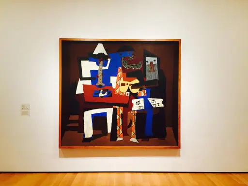 En kubistisk målning av Pablo Picasso föreställer musiker med instrument och noter.