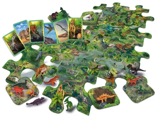 Zestaw do gry o dinozaurach: puzzle z prehistorycznym krajobrazem, figurki i karty z wizerunkami gadów.