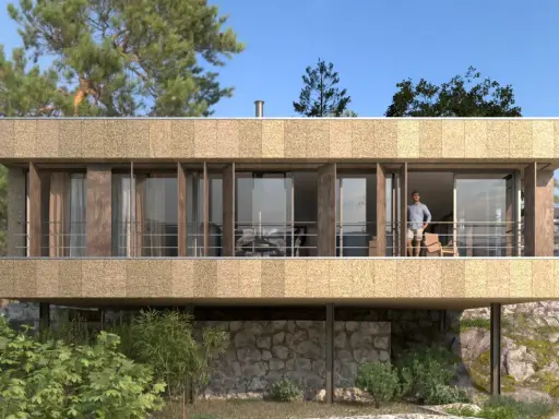 Casa moderna con fachada texturizada y grandes ventanales. Un hombre en el balcón. ¿Cuánto cuesta hacerse una casa teniendo el terreno?