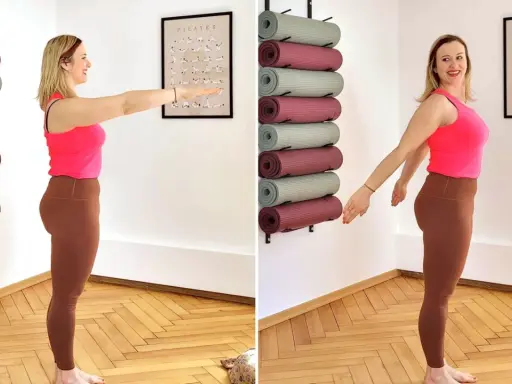 Frau übt tiefe Atmung zur Beruhigung, um sich auf Pilates vorzubereiten. Yogamatten sind an der Wand aufbewahrt.