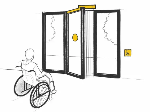 Persona en silla de ruedas se acerca a puertas automáticas, cumpliendo la normativa de puertas de portales para accesibilidad.