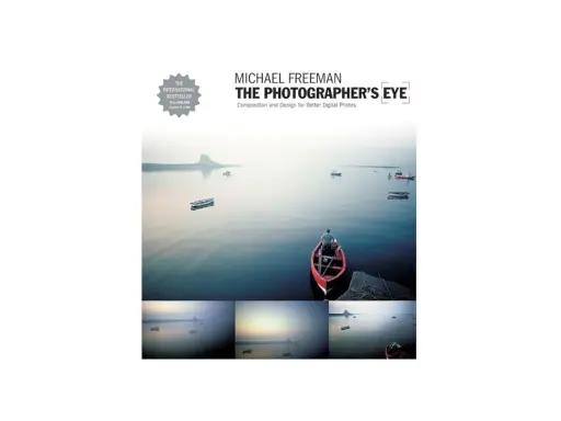 Book cover for "The Photographer's Eye" by Michael Freeman, featuring a serene seascape with boats and a lone figure in a red boat, showcasing the power of a photographer's eye.