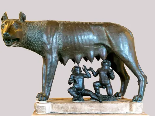 Wilczyca karmiąca Romulusa i Remusa, symboliczna scena z mitologii rzymskiej.