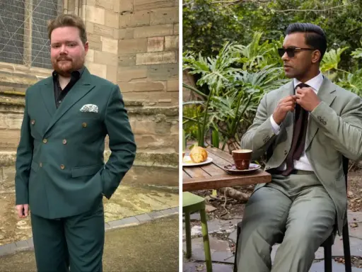 Two men in stylish suits. One wears a dark green suit with a black shirt, the other a lighter green suit with a white shirt and brown tie.