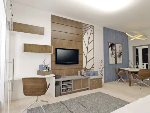 Un soggiorno moderno con scrivania, TV e zona pranzo. Il marrone e il grigio stanno bene insieme, creando un'atmosfera accogliente.