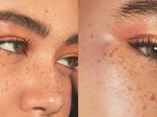 El iluminador se pone después del maquillaje para un brillo natural. Rostro con pecas y maquillaje de ojos cálido.