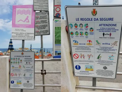 Cartelli informativi su una spiaggia libera attrezzata con regole di distanziamento e norme di comportamento.