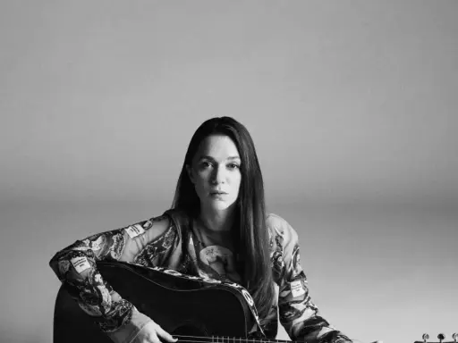 Melissa Horn med gitarr, en bild som hintar om kommande evenemang med Melissa Horn.