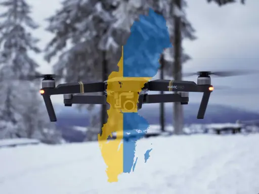Eine Drohne mit der schwedischen Flagge fliegt über eine verschneite Landschaft.