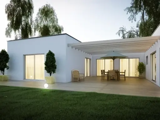 Une terrasse moderne avec mobilier de jardin et pergola, entourée d'un jardin verdoyant et d'arbres. Une extension de maison qui invite à la détente, parmi les plus belles extensions de maison.
