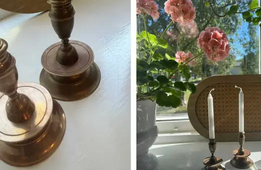 Två antika ljusstakar i mässing, redo att putsa. En kruka med rosa pelargoner står bredvid.