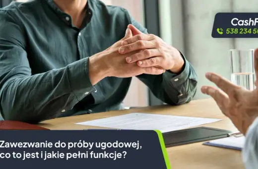 Dwaj mężczyźni przy stole omawiają dokumenty. Na dole grafiki widnieje tekst "Zawezwanie do próby ugodowej".