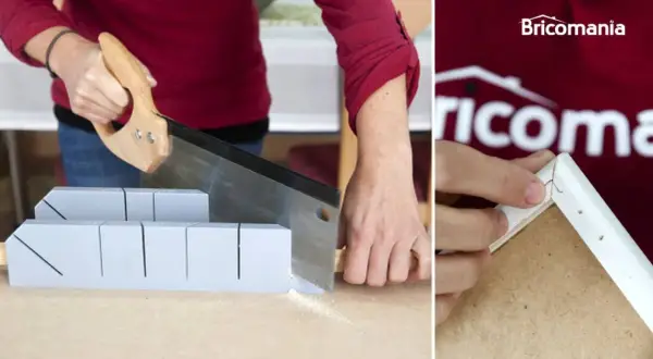 Manos cortando madera con sierra y caja de inglete para un corte a inglete sin ingletadora.