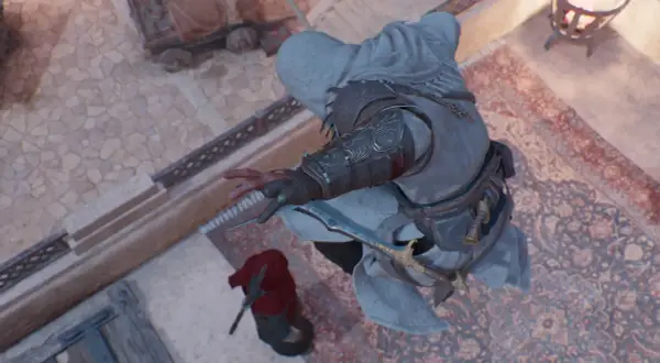 Assassin's Creed Mirage poradnik: Basim przygotowuje się do ataku z ukrycia, ostrze wysunięte.