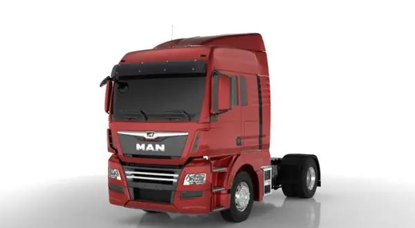 Cabine rouge d'un camion MAN, prête pour une longue route. Ce camion américain est un géant des autoroutes.