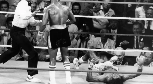 Referee watches as one boxer is down during the Hearns vs Hagler fight.