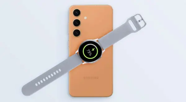 Une montre Samsung est en cours de charger sur un téléphone, affichant 75% de batterie.