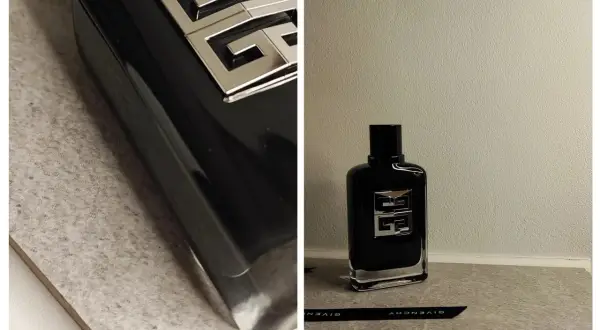 Elegancka, czarna butelka perfum Givenchy Gentleman Society z charakterystycznym, srebrnym logo.