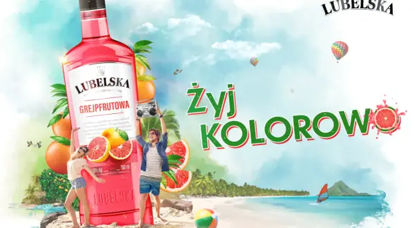 Lubelska litr grejpfrutowa na plaży, z ludźmi tańczącymi i balonami na niebie. Żyj kolorowo!
