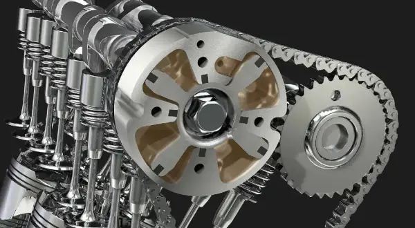 Mechanizm rozrządu silnika z widocznymi zaworami i wałkiem. Niewłaściwa regulacja zaworów objawy mogą być poważne.