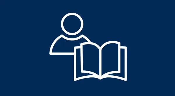 Eine Person mit einem offenen Buch. Das Symbol steht für die Definition von "lesen" und das Erlernen von Wissen.