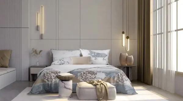 Elegancka sypialnia w stylu hotelowym z łóżkiem, ozdobnym pledem i nowoczesnymi lampami.