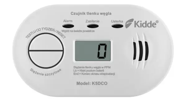 Biały czujnik tlenku węgla Kidde z wyświetlaczem pokazującym "0" i przyciskiem Test/Reset.