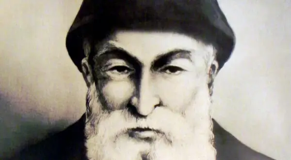 Portret ojca Szarbel, starszego mężczyzny z bujną białą brodą i w czarnym nakryciu głowy.