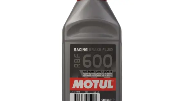 Szara butelka płynu hamulcowego Motul RBF 600 z czerwoną zakrętką.