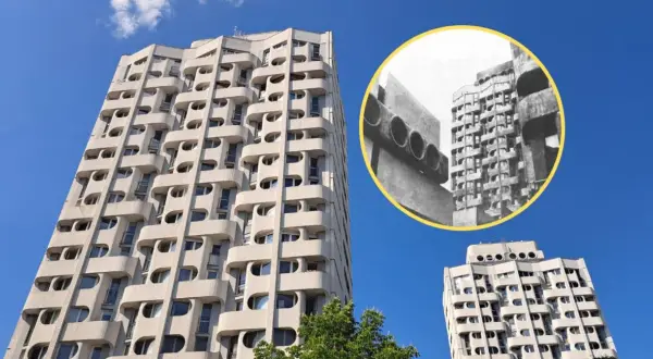 Wrocławski Manhattan: charakterystyczne bloki z lat 70. z falującymi balkonami i okrągłymi oknami, na tle błękitnego nieba.
