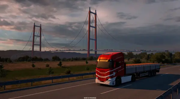 Czerwona ciężarówka na moście, zachód słońca. Idealna grafika do sprawdzenia wymagań Euro Truck Simulator 2.