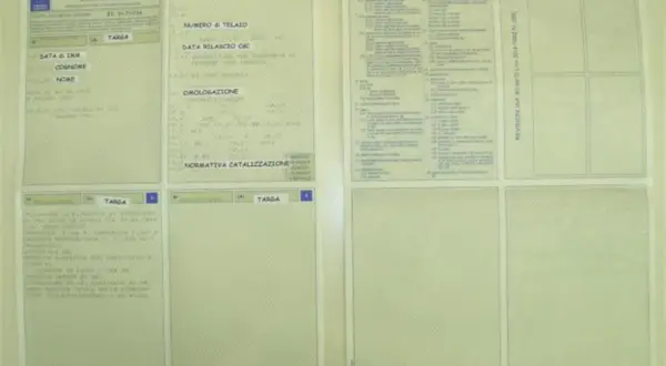 Italian vehicle registration documents with fields for chassis number, license plate, and homologation.