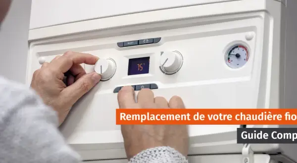 Main tenant un bouton de réglage sur une chaudière. Un guide complet sur le changement de chaudière fioul.
