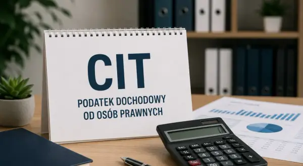 Biurko z kalendarzem "CIT PODATEK DOCHODOWY OD OSÓB PRAWNYCH", kalkulatorem, notatnikiem i wykresami.