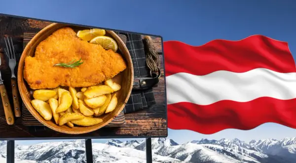 Szwajcarski schabowy z frytkami, symbol kuchni austriackiej, na tle flagi Austrii i ośnieżonych gór.