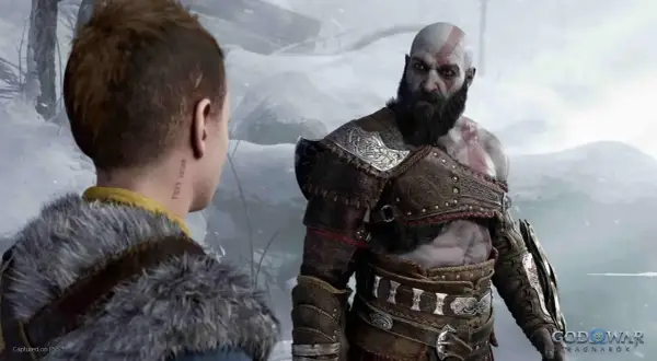 Kratos i Atreus w śnieżnym krajobrazie. Zastanawiasz się, god of war ile godzin zajmie Ci ta epicka podróż?