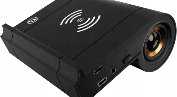 Czarny głośnik z ładowarką indukcyjną i wejściem AUX. Czy słuchawki JBL są kompatybilne z iPhone? Ten gadżet może być odpowiedzią.