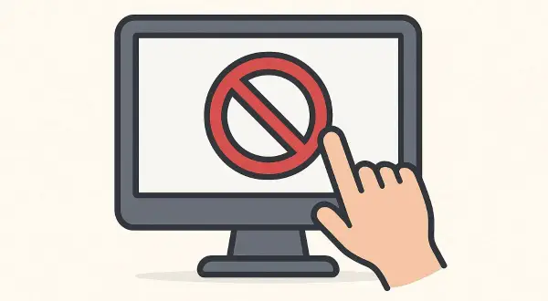 Palec wskazujący dotyka czerwonego symbolu zakazu na ekranie komputera, ilustrując, jak zablokować stronę internetową.